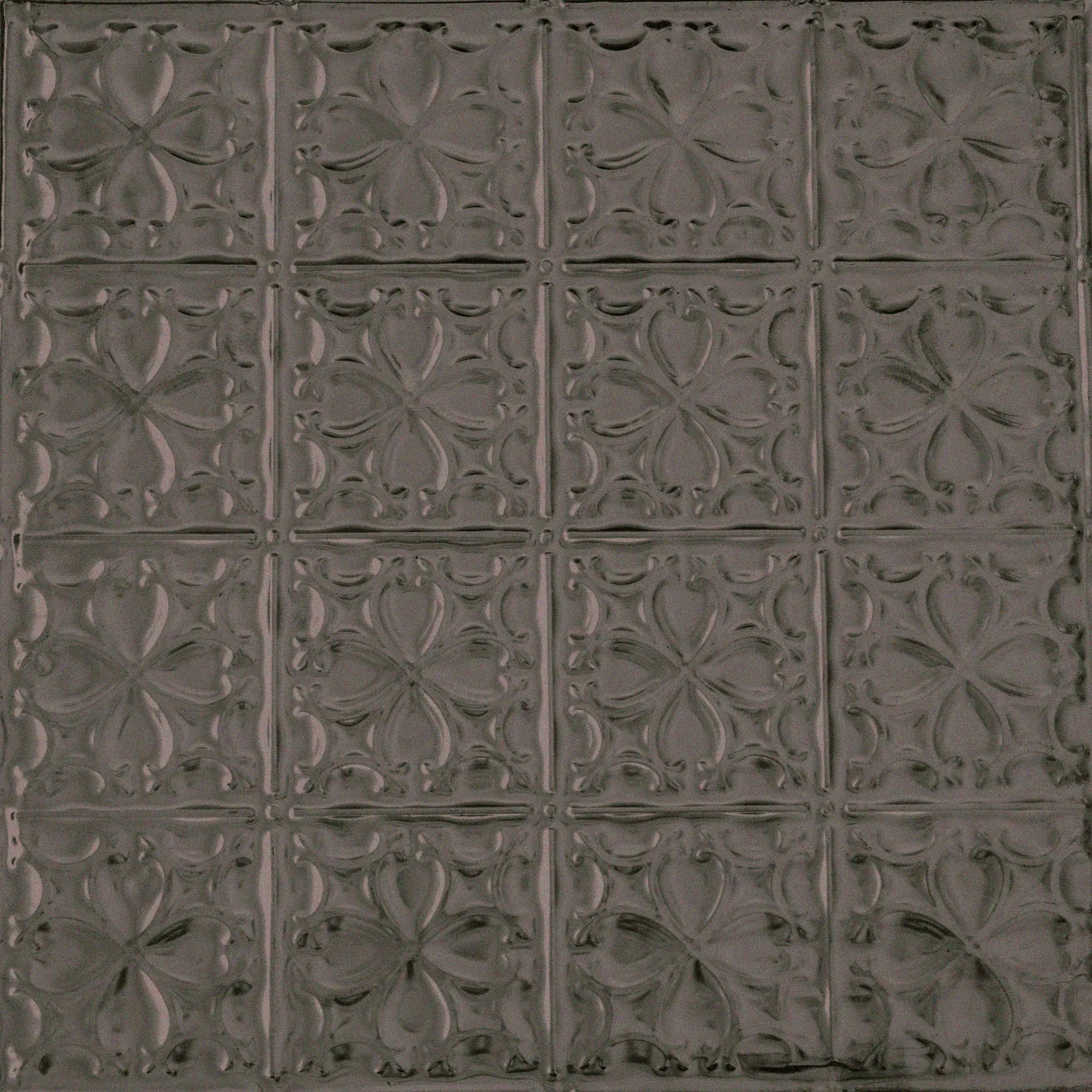 Decorative metallic panel with embossed floral pattern.