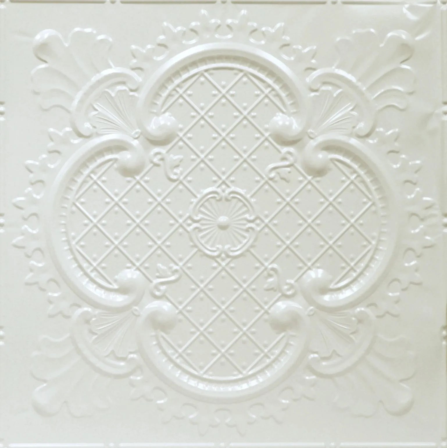 Decorative white tile with intricate patterns on a white background.