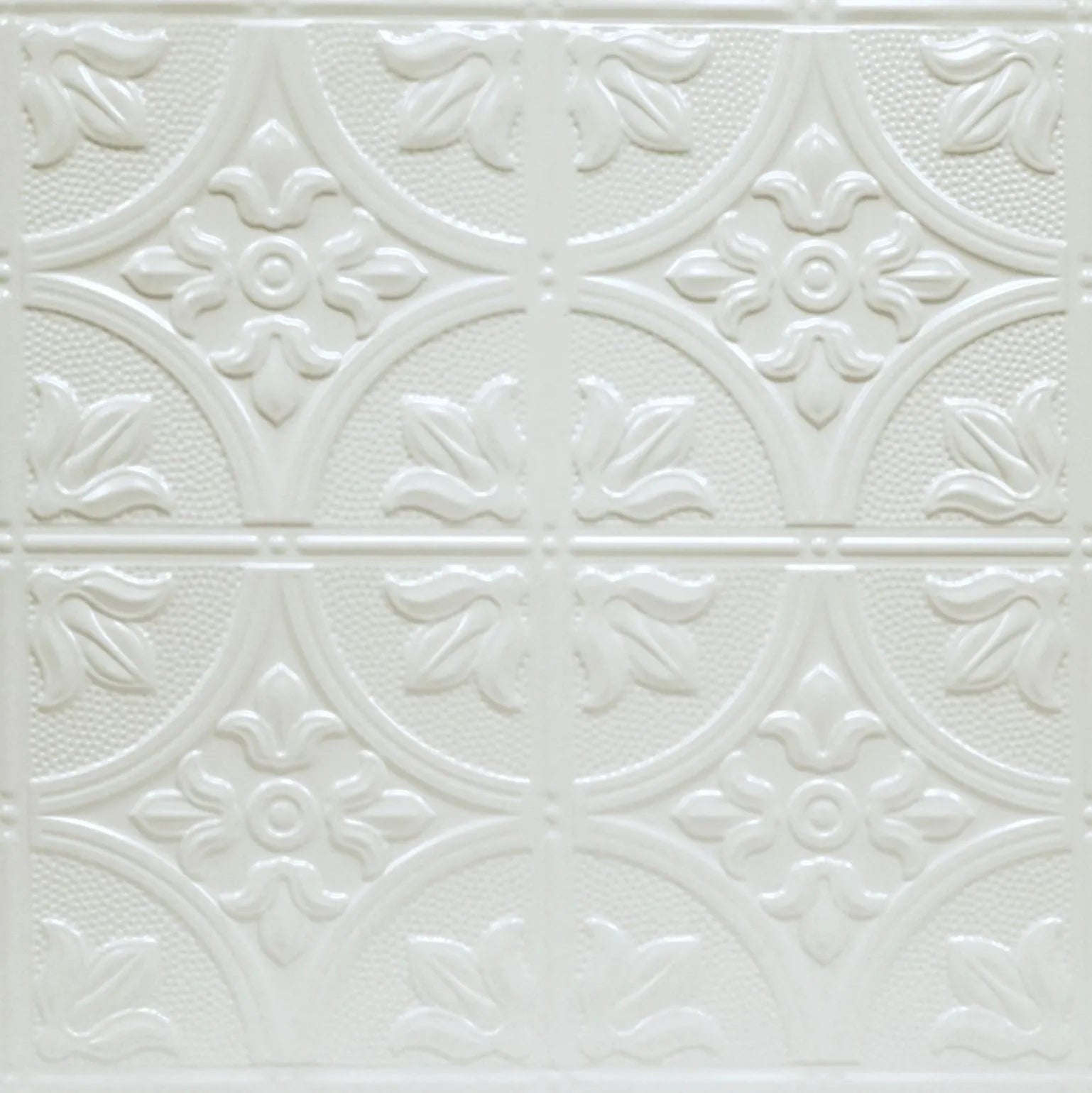 Decorative white tile with floral patterns on a white background