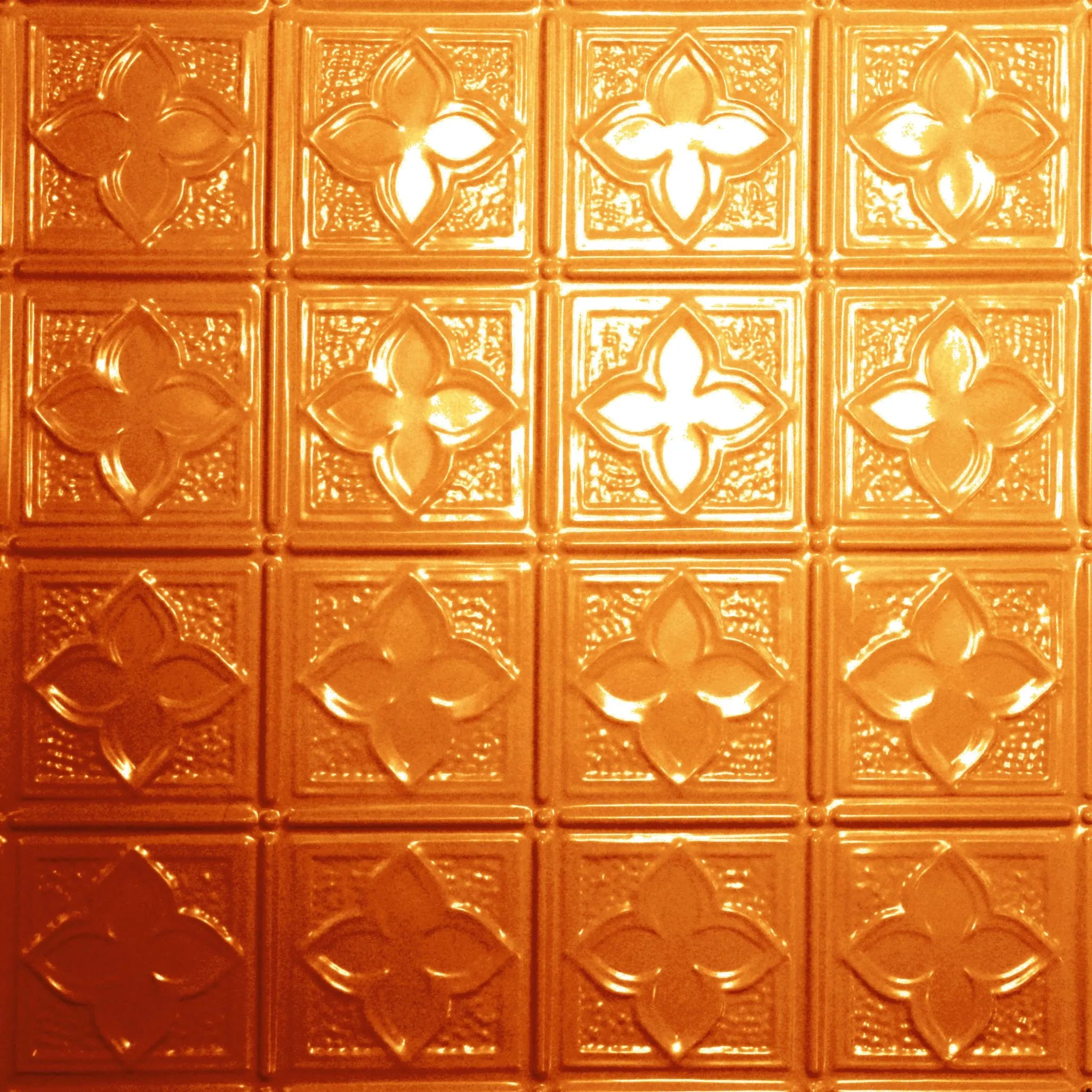 Decorative gold ceiling tiles with floral patterns.