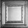 Decorative silver frame with intricate designs on a white background.