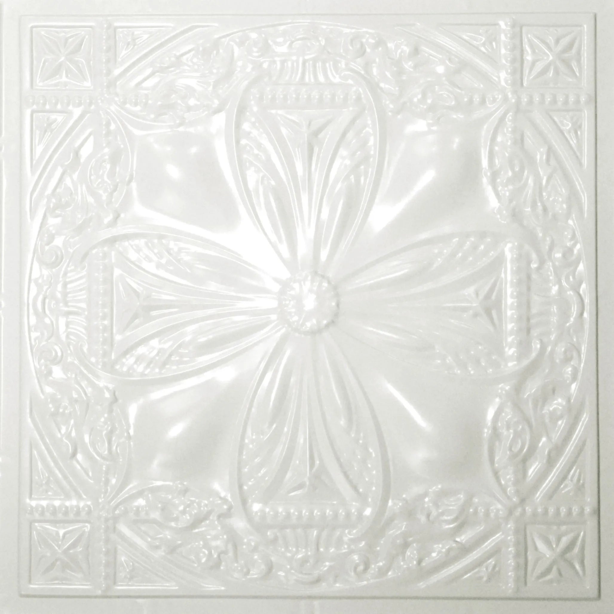 Decorative white ceiling tile with intricate patterns