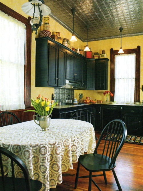 Vintage-style kitchen with dark wood cabinets.