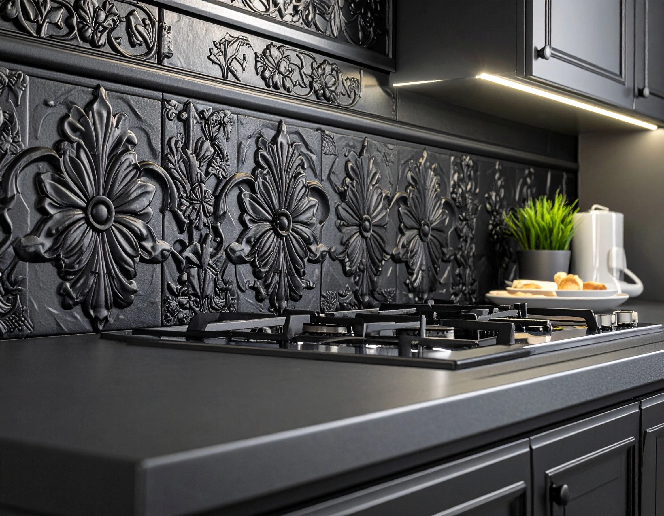 Modern kitchen with decorative black backsplash and stainless steel appliances.