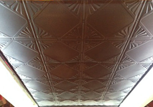 Ceiling with a textured, diamond-patterned design.