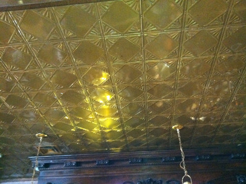 Decorative ceiling with geometric pattern and light fixture
