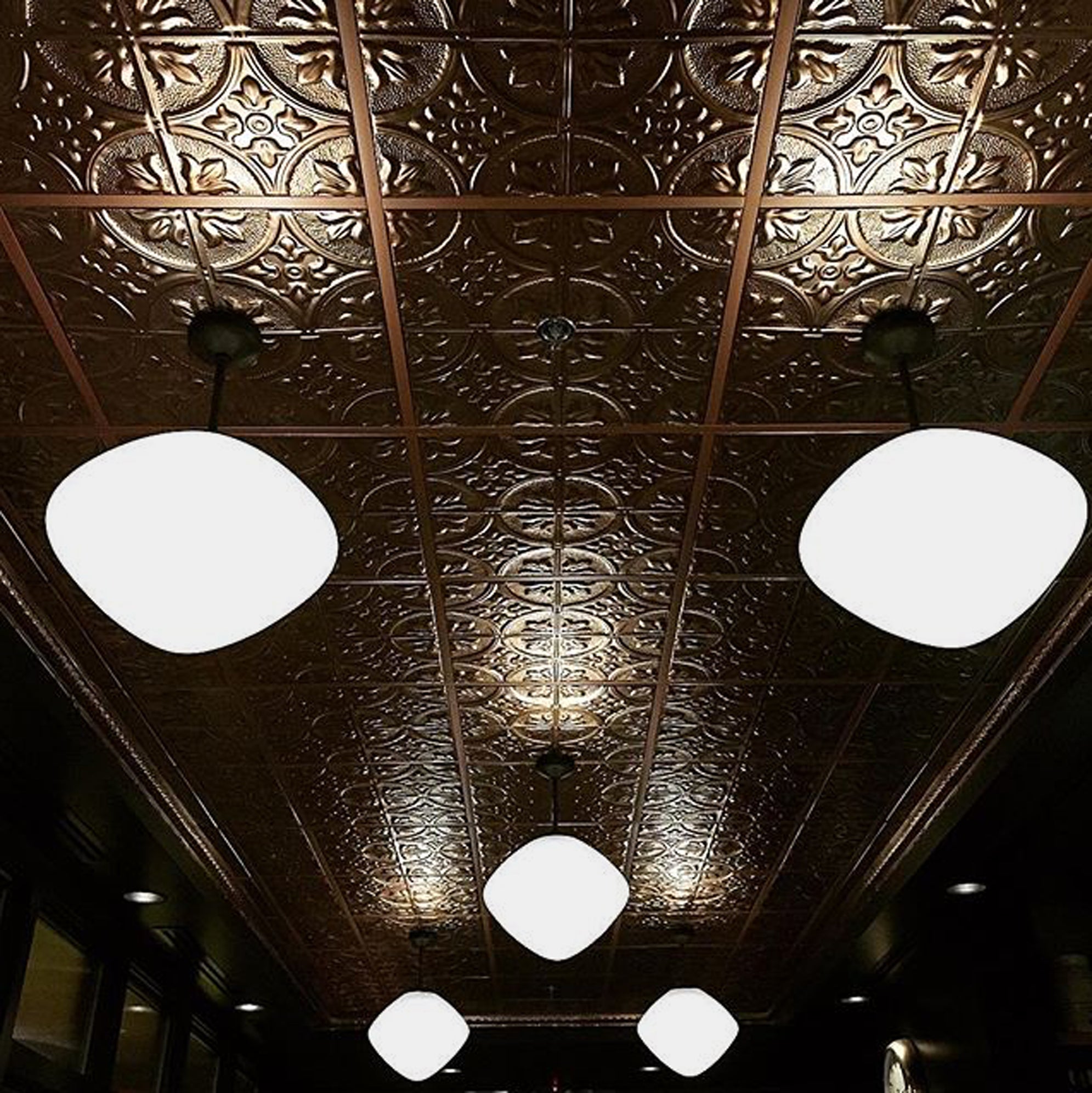 Decorative ceiling with embossed pattern and pendant lights