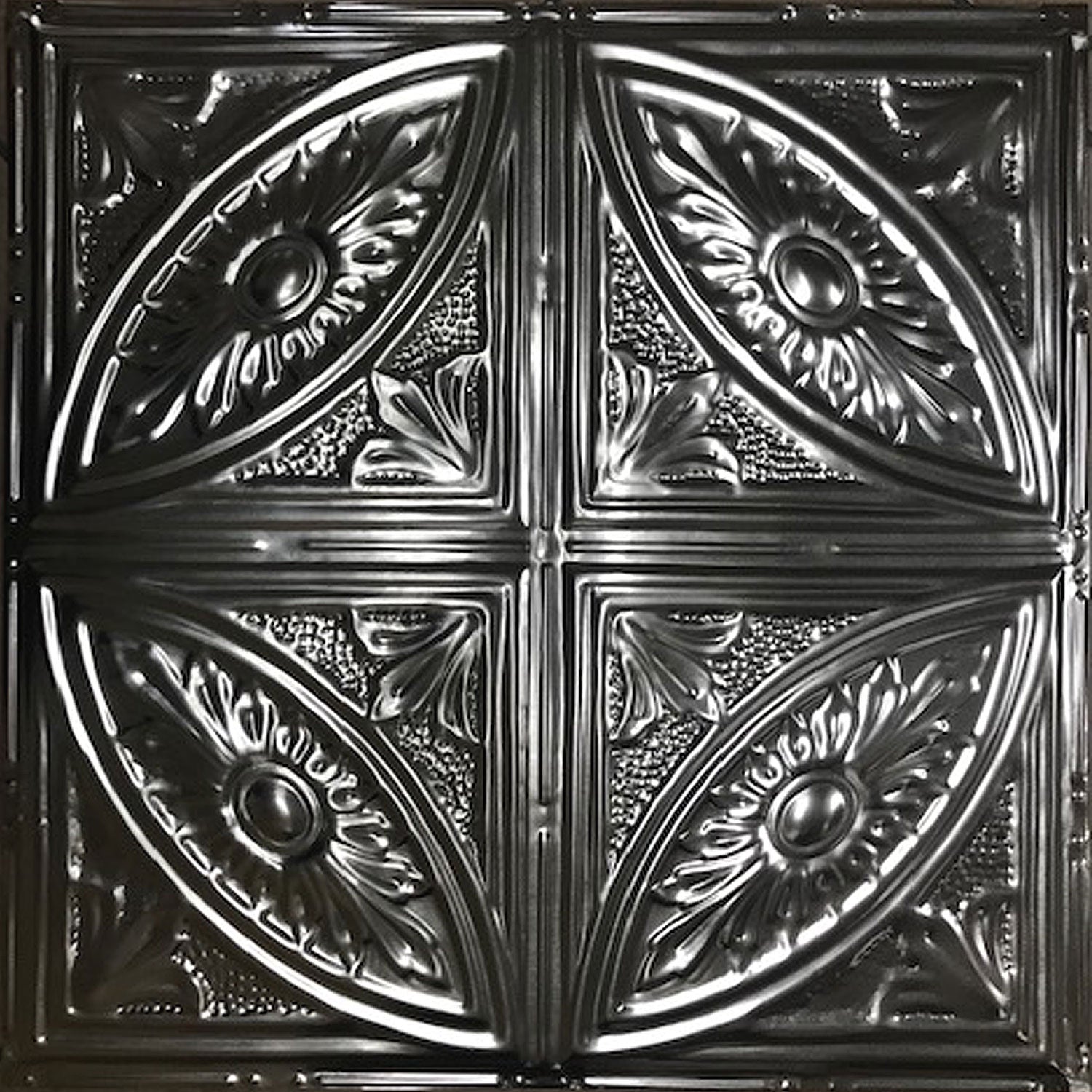 Decorative metal ceiling tile with intricate patterns.