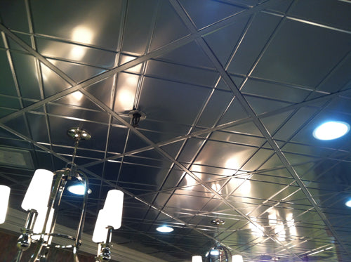 Ceiling with reflective tiles and ceiling lights