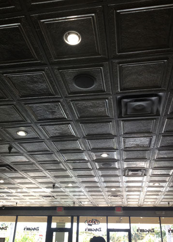 Ceiling with a grid pattern and recessed lights