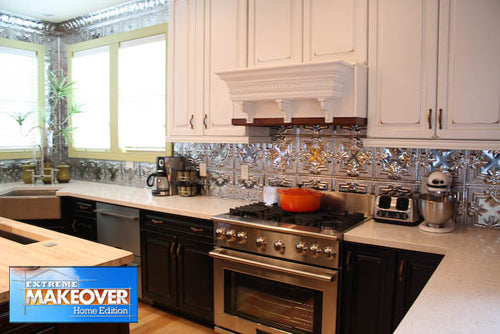 Modern kitchen with stainless steel appliances and decorative backsplash