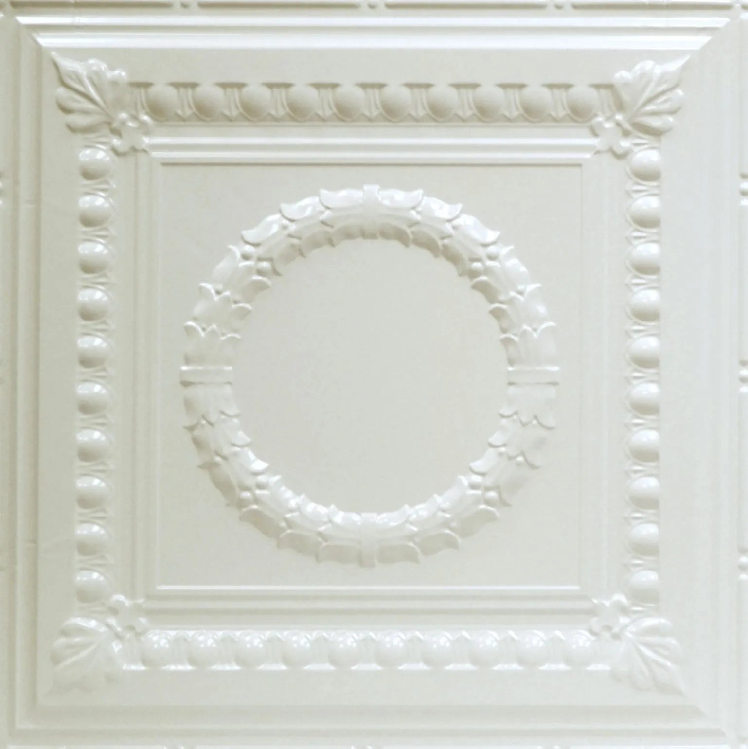 Decorative white ceiling tile with intricate patterns.