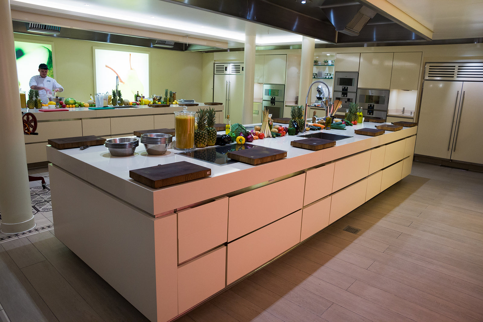 Modern kitchen with a large island and various appliances.