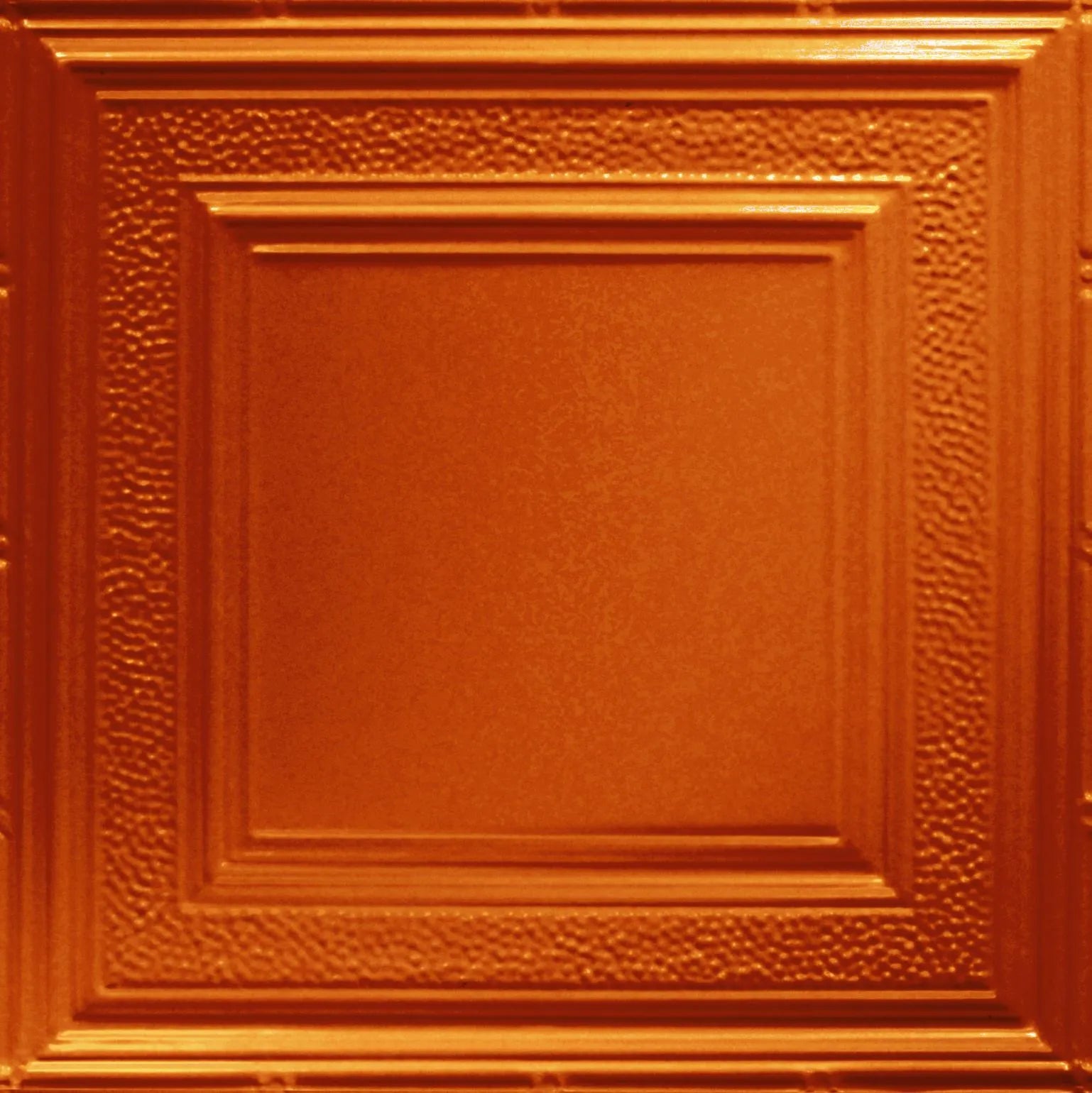 Close-up of a textured orange panel with decorative border.