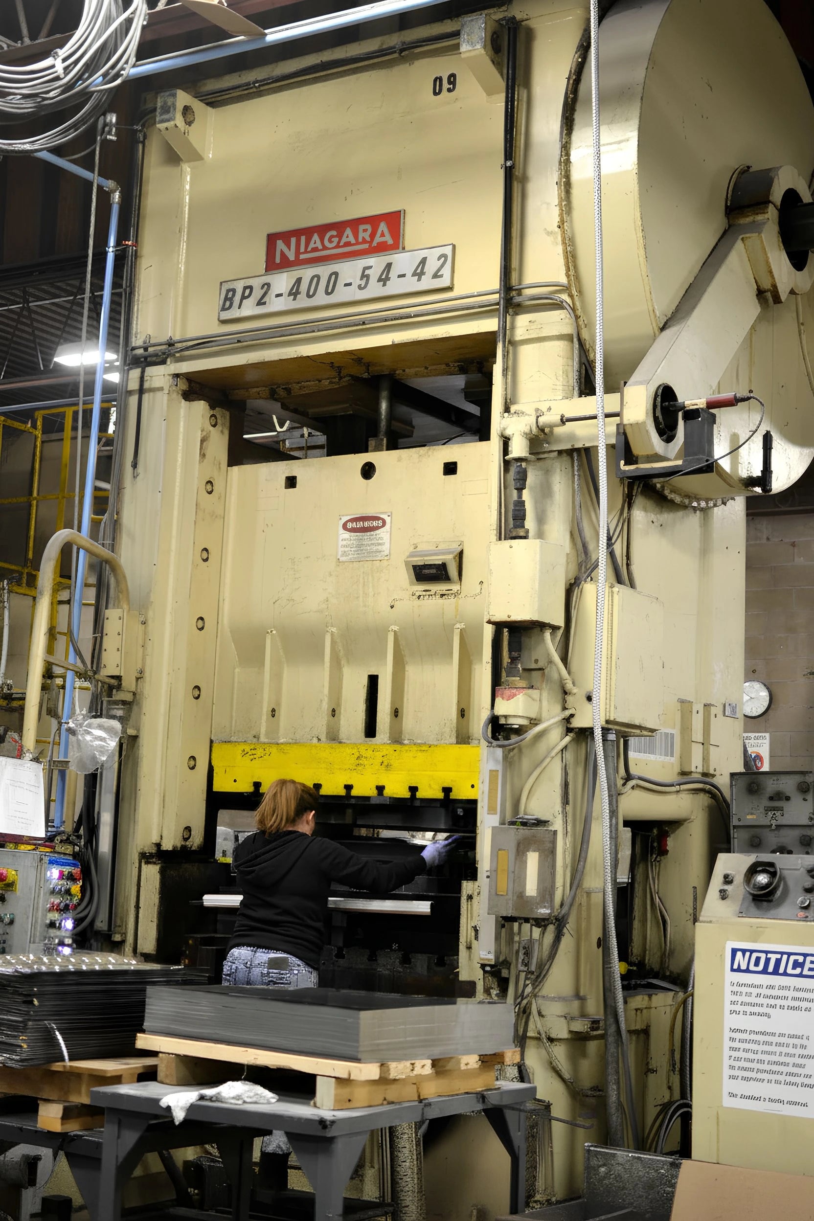 Large industrial press with 'Niagara' branding in a factory setting