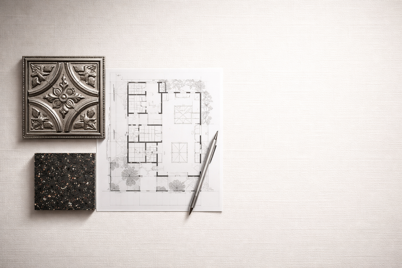 Architectural floor plan on paper with decorative tiles.