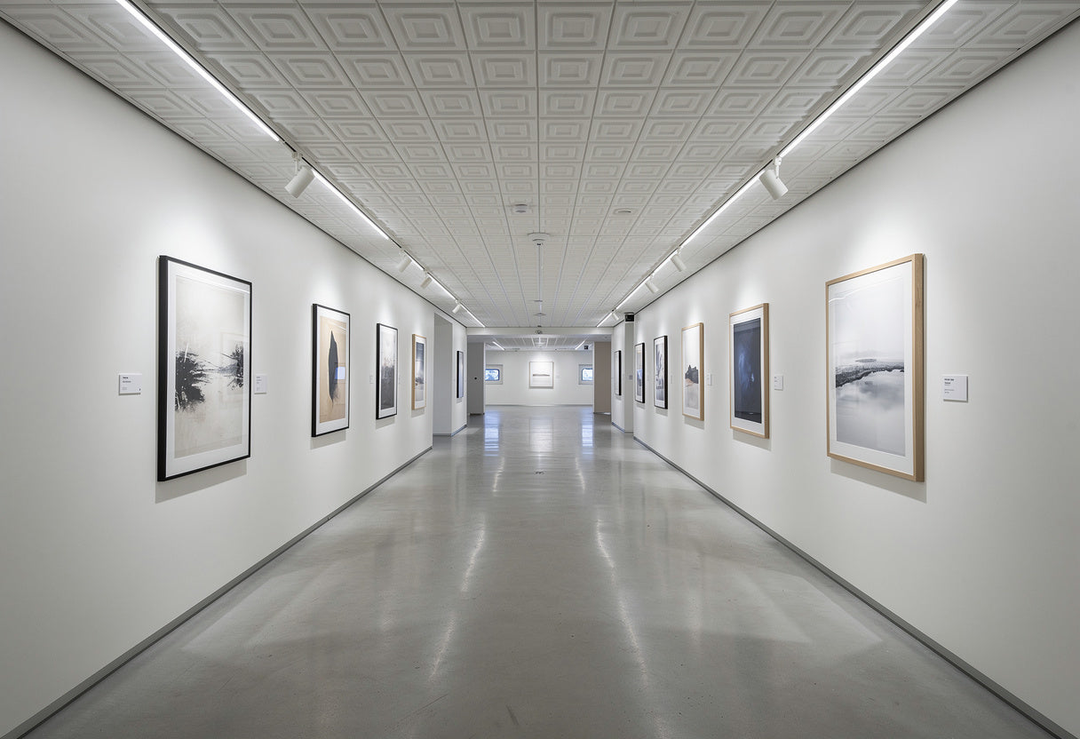 Long hallway with art on the walls in a modern building.
