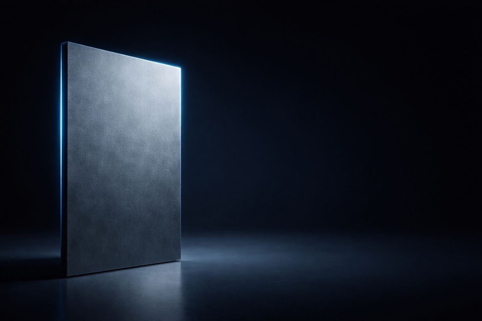 Dark metallic book or folder with a glowing edge on a black background.