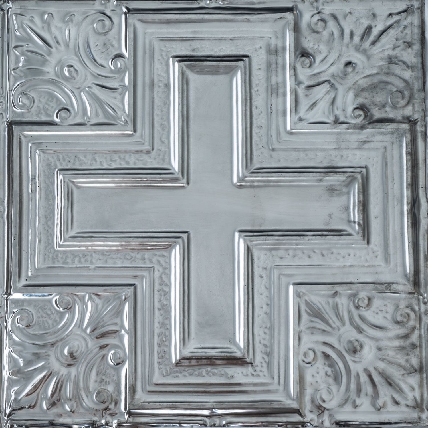 Decorative metallic ceiling tile with intricate patterns