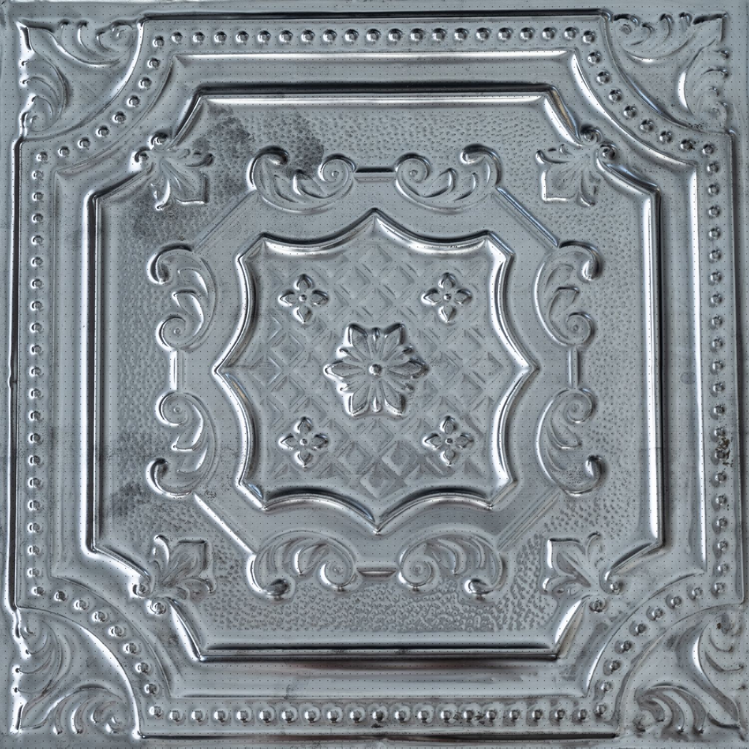 Decorative metallic ceiling tile with intricate patterns