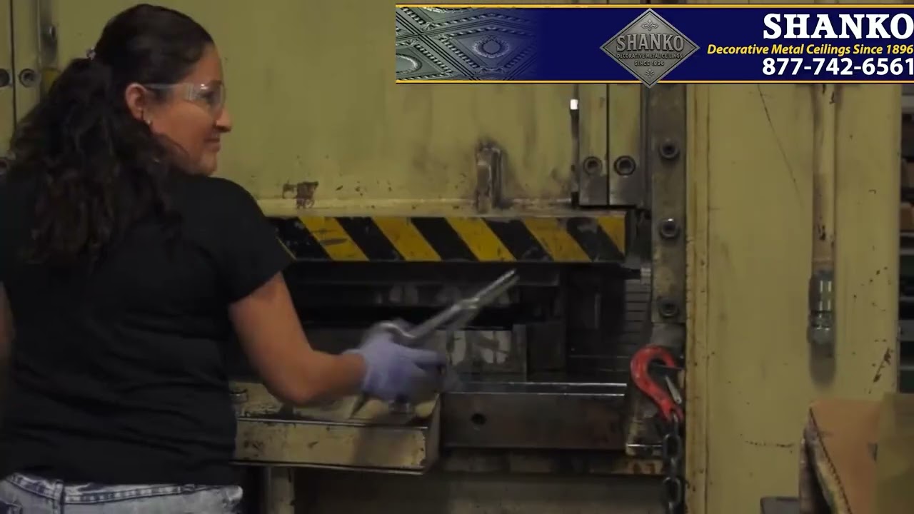 Person operating a large industrial machine with 'Shanko' branding in the corner.