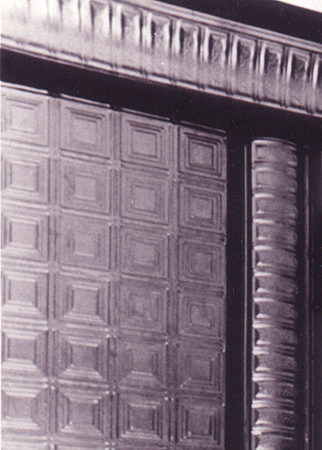 Close-up of a textured metal surface with geometric patterns